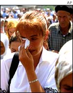 Woman weeping during Thursday's remembrance service