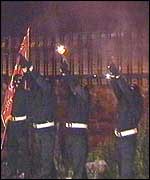 Loyalist paramilitaries fire shots at an 11th night bonfire in west Belfast