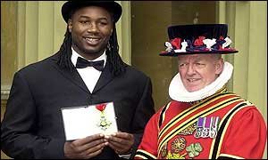 Lennox Lewis receives his CBE at Buckingham Palace