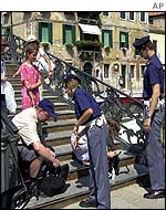 Italian police search tourists' bags on the steps of the Jewish Ghetto in Venice