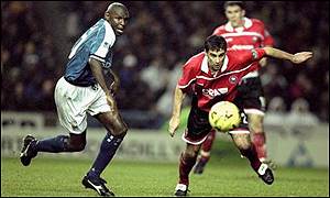 Chris Barker (right) challenges Shaun Goater
