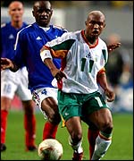 Senegal's El Hadji Diouf shields the ball from France's Patrick Vieira