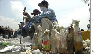 Farmers sit with a supply of Molotov cocktails