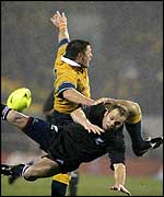 Matthew Burke and Chris Cullen collide during the Christchurch match between Australia and New Zealand
