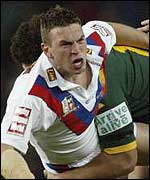 Kevin Sinfield is tackled by the Australians