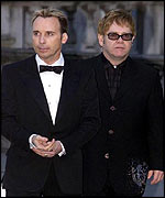 Sir Elton John (l) and partner David Furnish at a recent charity event