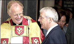 Former British Prime Minister and president of Surrey John Major chats with Colin Snee, the Dean of Southwark