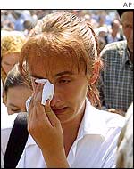 Bosnian Muslim at memorial service for victims of Srebrenica massacre