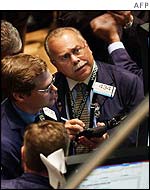 Traders watch prices at the New York stock exchange