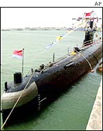 A Chinese Navy submarine docks at a Navy base in Qingdao, China 
