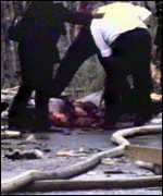 Emergency services inspect a victim of the Bloody Friday bombings