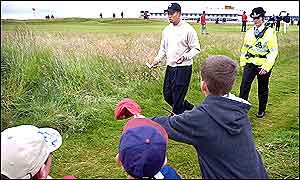 Young fans try and get Tiger Woods' autograph