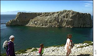 Moroccans walk by Perejil