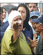 A Moroccan woman shouts abuse at Spaniards