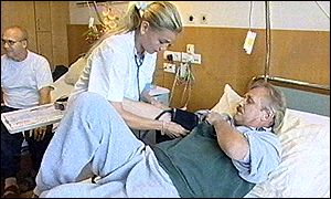 Nurse takes blood pressure reading