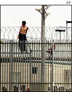 Protester amid razor wire at Woomera