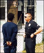 An LAPD officer questioning a suspect