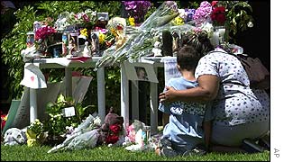 Neighbours pay respects at a memorial to Samantha Runnion in Stanton, California