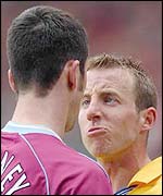 Lee Bowyer confronts Aston Villa's Mark Delaney