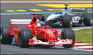 Michael Schumacher leads Kimi Raikkonen during the French Grand Prix