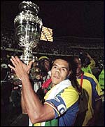 Ivan Cordoba lifts the trophy after Colombia beat Mexico in the Copa America final