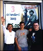 Pierluigi Pompignioli with customers at his shop in Predappio