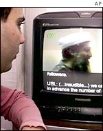 Man watches a video made by Osama bin Laden