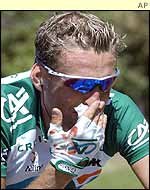 Christophe Moreau presses a bandage to his bloodied nose