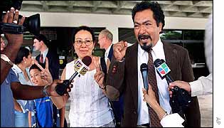 Plaintiffs Neris Gonzalez (left) and Carlos Mauricio outside Florida court house