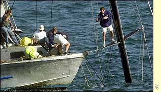 A salvage crew gets to work on Stars & Stripes