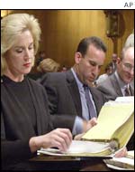 Bankers leafing through the evidence