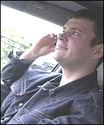 Man using mobile in car