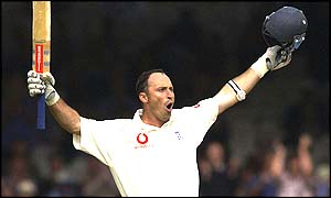 Nasser Hussain raises his bat after reaching his century against India at lord's