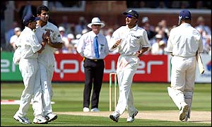 Alec Stewart leaves the field after being struck low on the pad by Zaheer