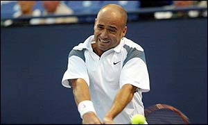 Andre Agassi puts in a huge effort against Gustavo Kuerten