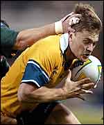 Ben Tune brushes off three tacklers to score Australia's opening try