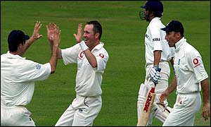 Craig White takes the key wicket of Sachin Tendulkar