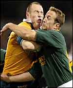 Australia's Stirling Mortlock clashes with Stefan Terblanche of South Africa