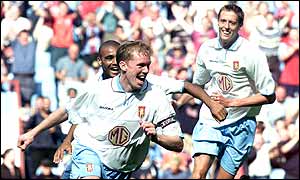 Villa captain Steve Staunton celebrates scoring Villa's winner