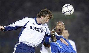 Tim Sherwood heads the ball clear of Marcus Bent