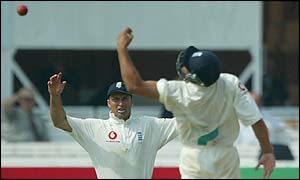 Nasser Hussain sees a chance evade Mark Butcher during the morning session