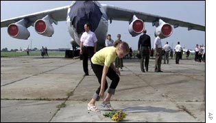 Flowers are laid at the ceremony at the Sknyliv base