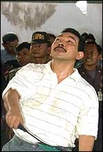 Tommy playing badminton in prison