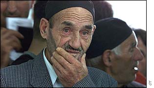 An ethnic Albanian queues at a polling station in Veliki Trnovac on Sunday 28 July 2002