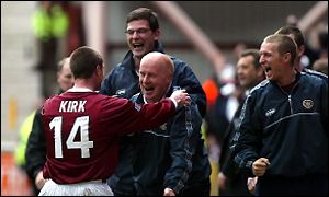 Andy Kirk celebrates with the Hearts management team