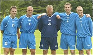 Jim Jefferies with his new signings
