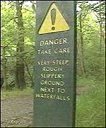 Safety sign near waterfalls