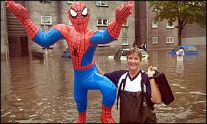 Woman holding Spiderman inflatable