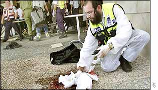 Orthodox Jew medic mops blood from the ground