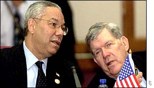 US Secretary of State Colin Powell (l) talks to his deputy, James Kelly